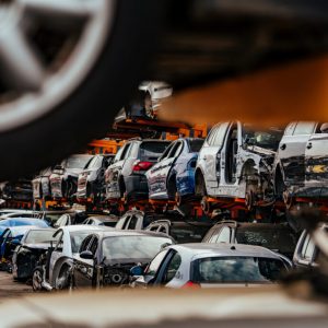 Damaged,Cars,Waiting,In,A,Scrapyard,To,Be,Recycled,Or